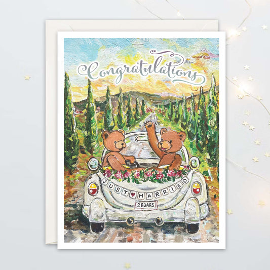 Painting of two bears in a Volkswagen Beetle convertible with a 'Just Married' sign, as they drive off into the Tuscan Sunset. Decorative text say "Congratulations"