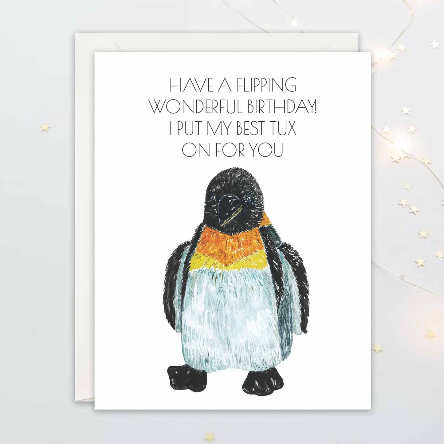 Card with a penguin illustration and humorous birthday message on a white background "Have a flipping wonderful birthday! I put my best tux on for you"