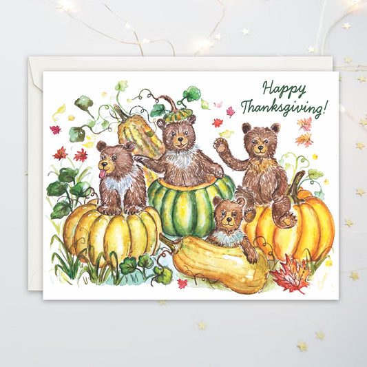 Thanksgiving card with mischievous bears frolicking in a pumpkin patch