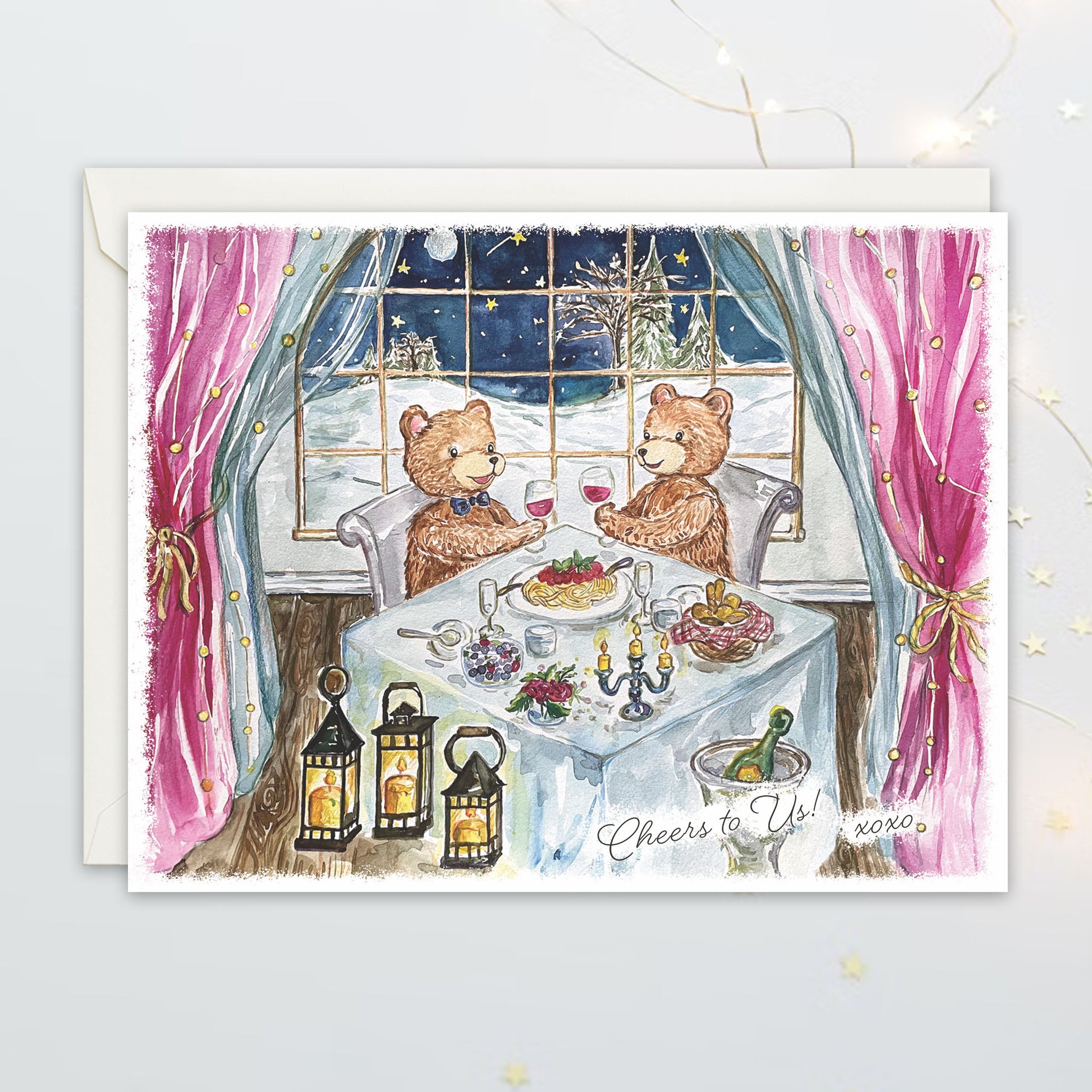 Greeting card with two bears at a dinner table in a window, surrounded by lanterns and a snowy scene outside.