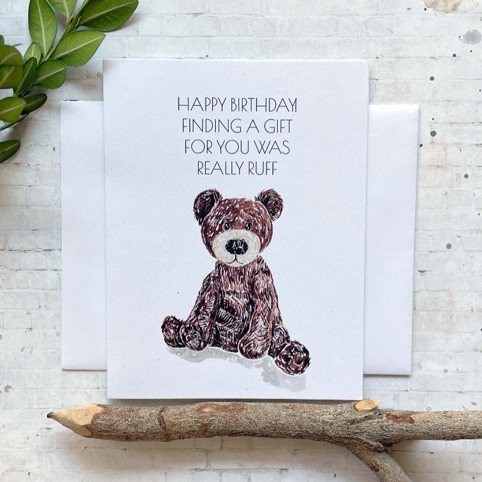 Greeting card with a teddy bear illustration and humorous text on a white background.
