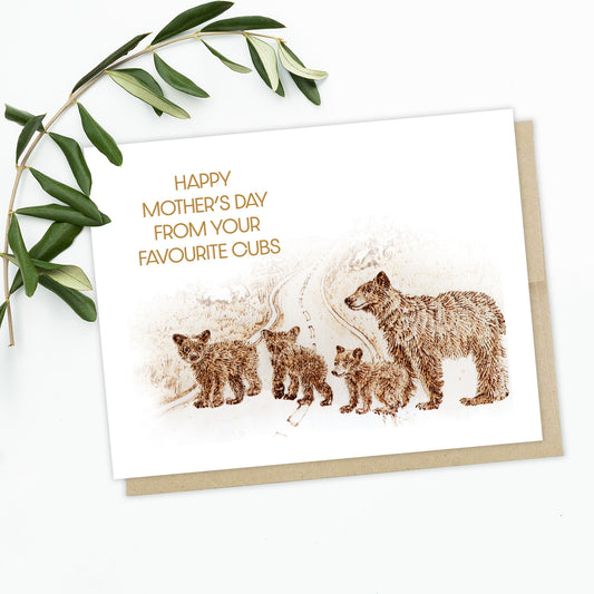 Image of a greeting card with leaves in the background. The card features a family of brown grizzly bears crossing the street with Mama Bear and three little cubs. The text reads: Happy Mother's day from your favourite cubs.